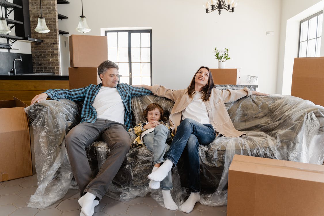 Family on couch new home