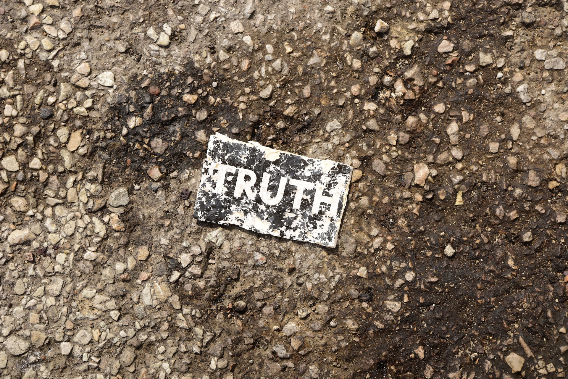 A little piece of paper on the ground.