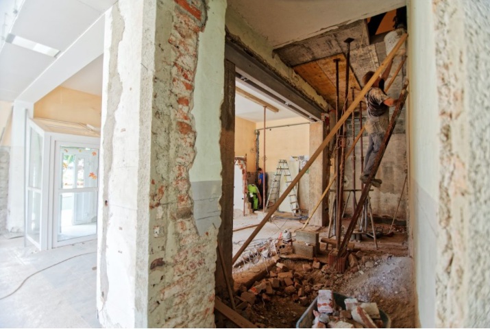 man on ladder remodeling