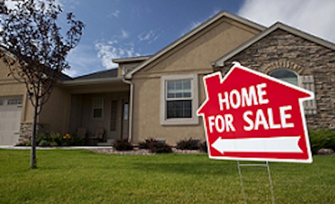 Home for Sale sign in front of house