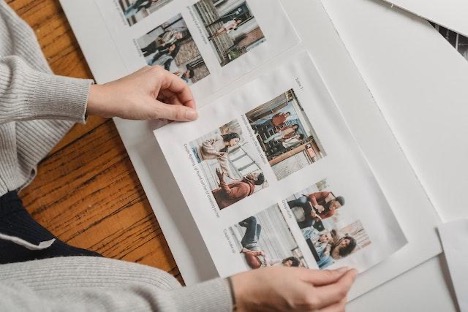 A person looking at photos in an album