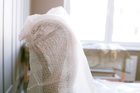 A chair wrapped in bubble wrap