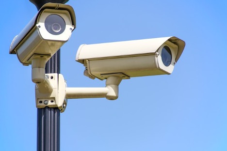 Two security cameras attached to a black post is one of the things you have to leave behind when selling your home