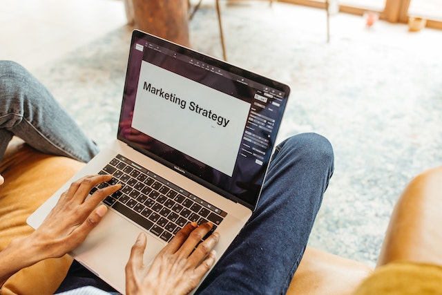 Person creating a marketing strategy on their laptop